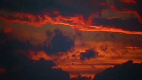 The movement of clouds across the red sky Stock Footage 151427246