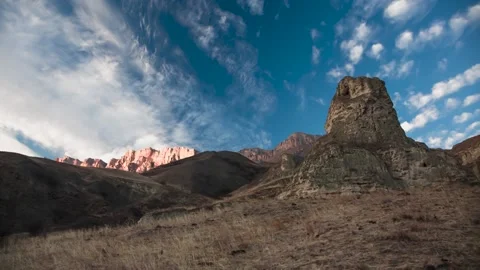 The movement of clouds across the sky over the mountains Stock Footage 149380584