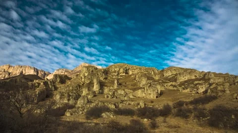 The movement of clouds across the sky over the mountains Stock Footage 149380605