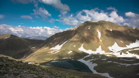 The movement of clouds across the sky over the mountains. Stock Footage 158458871