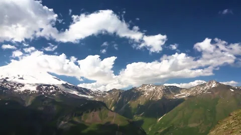 The movement of clouds across the sky over the mountains. Stock Footage 158859355