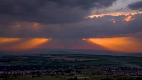 The movement of clouds and rain across the evening sky Stock Footage 151425602