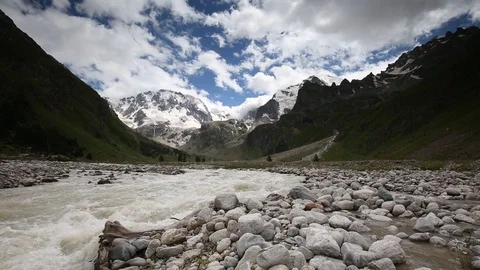 Movement of clouds and water flows in a stormy river in the mountains Stock Footage 86486340