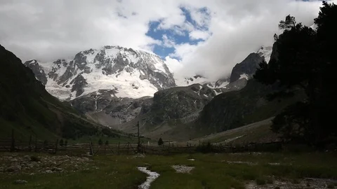 Movement of clouds and water flows in a stormy river in the mountains Stock Footage 86487025