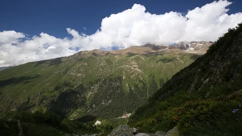Movement of clouds and water flows in a stormy river in the mountains Stock Footage 86487439