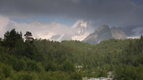 Movement of clouds and water flows in a stormy river in the mountains Stock Footage 86488023