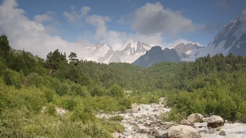 Movement of clouds and water flows in a stormy river in the mountains Stock Footage 86488412