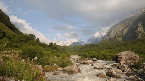Movement of clouds and water flows in a stormy river in the mountains Stock Footage 86488825