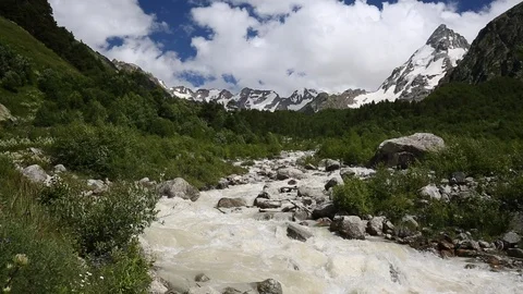 Movement of clouds and water flows in a stormy river in the mountains Stock Footage 86490042