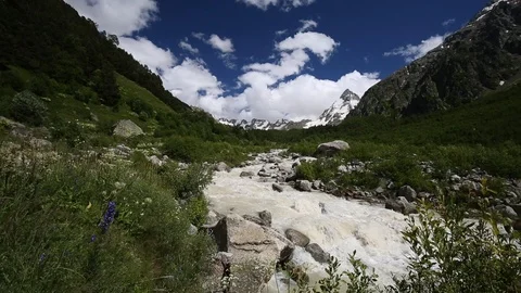Movement of clouds and water flows in a stormy river in the mountains Stock Footage 86490052