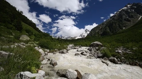 Movement of clouds and water flows in a stormy river in the mountains Stock Footage 86490145
