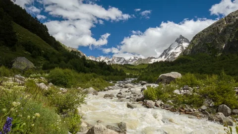 Movement of clouds and water flows in a stormy river in the mountains Video stock 86992772