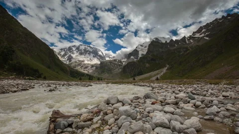 Movement of clouds and water flows in a stormy river in the mountains Video stock 86995397