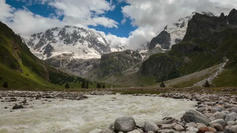 Movement of clouds and water flows in a stormy river in the mountains Video stock 86995544