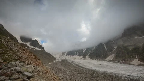 Movement of clouds and water flows in a stormy river in the mountains Video stock 87297196