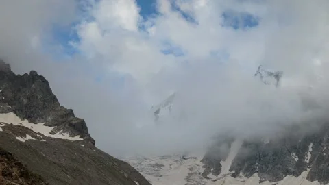 Movement of clouds and water flows in a stormy river in the Caucasus mountais Video stock 87297428