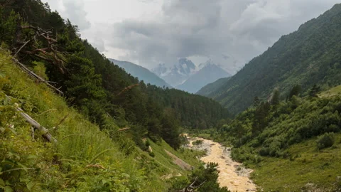 Movement of clouds and water flows in a stormy river in the mountains Video stock 87301288