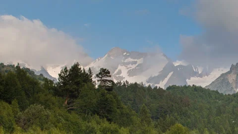 Movement of clouds and water flows in a stormy river in the Caucasus mountais Video stock 87301365