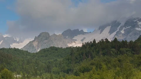 Movement of clouds and water flows in a stormy river in the Caucasus mountais Video stock 87301407