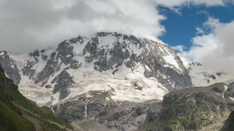 Movement of clouds and water flows in a stormy river in the Caucasus mountais Video stock 87301454