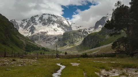 Movement of clouds and water flows in a stormy river in the mountains Video stock 87301464