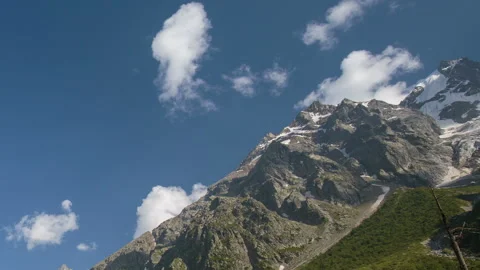 Movement of clouds and water flows in a stormy river in the Caucasus mountais Stock Footage 87348390