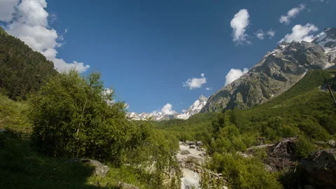Movement of clouds and water flows in a stormy river in the mountains Stock Footage 87348685