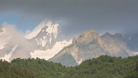 Movement of clouds and water flows in a stormy river in the Caucasus mountais Stock Footage 87350404