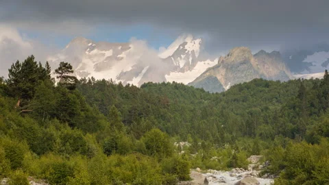 Movement of clouds and water flows in a stormy river in the mountains Stock Footage 87350466