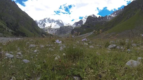 Movement of clouds and water flows in a stormy river in the Caucasus mountains Stock Footage 87532880