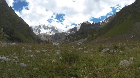 Movement of clouds and water flows in a stormy river in the Caucasus mountains Stock Footage 87532966