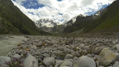 Movement of clouds and water flows in a stormy river in the Caucasus mountains Video stock 87533085