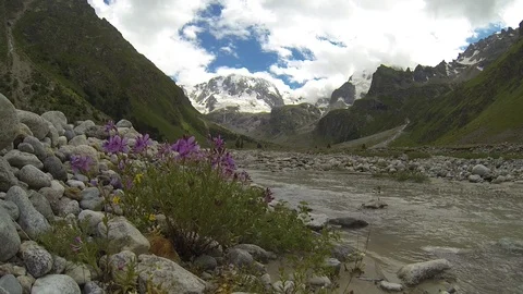 Movement of clouds and water flows in a stormy river in the Caucasus mountains Stock Footage 87533644