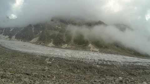 Movement of clouds and water flows in a stormy river in the Caucasus mountains Video stock 87534162