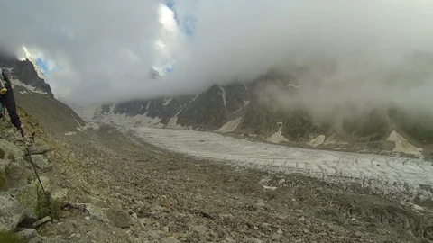 Movement of clouds and water flows in a stormy river in the Caucasus mountains Stock Footage 87534354