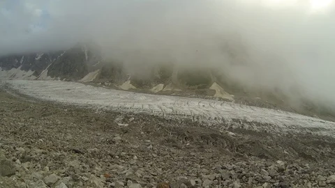 Movement of clouds and water flows in a stormy river in the Caucasus mountains Stock Footage 87534375