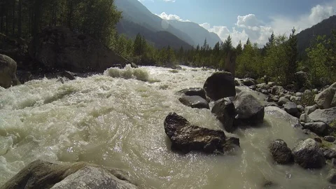 Movement of clouds and water flows in a stormy river in the Caucasus mountains Stock Footage 87535863