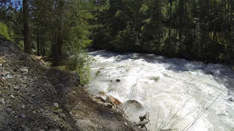 Movement of clouds and water flows in a stormy river in the Caucasus mountains Stock Footage 87536161