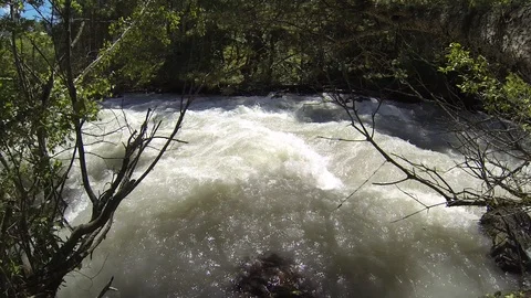 Movement of clouds and water flows in a stormy river in the Caucasus mountains Stock Footage 87536215