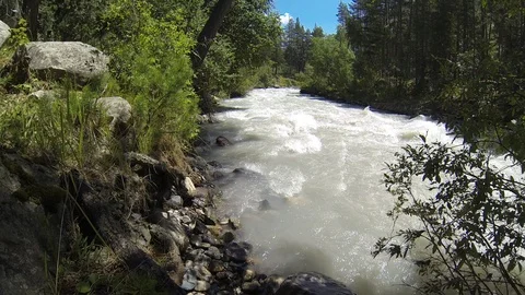 Movement of clouds and water flows in a stormy river in the Caucasus mountains Video stock 87536268