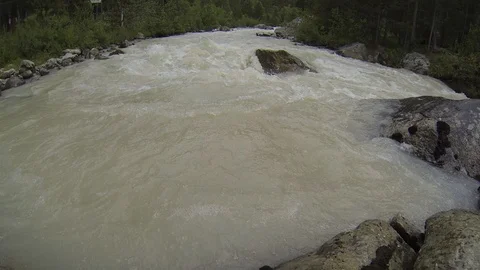 Movement of clouds and water flows in a stormy river in the Caucasus mountains Stock Footage 87536679