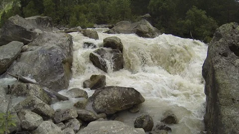 Movement of clouds and water flows in a stormy river in the Caucasus mountains Video stock 87536782