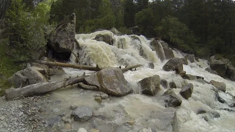 Movement of clouds and water flows in a stormy river in the Caucasus mountains Stock Footage 87536784