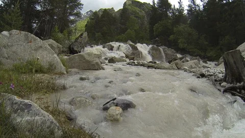 Movement of clouds and water flows in a stormy river in the Caucasus mountains Stock Footage 87536864