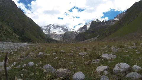 Movement of clouds and water flows in a stormy river in the Caucasus mountains Stock Footage 87537024