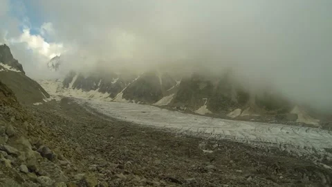 Movement of clouds and water flows in a stormy river in the Caucasus mountains Stock Footage 87615813