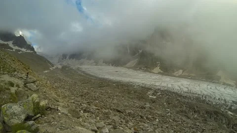 Movement of clouds and water flows in a stormy river in the Caucasus mountains Stock Footage 87615927