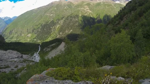 Movement of clouds and water flows in a stormy river in the Caucasus mountains Stock Footage 87617959