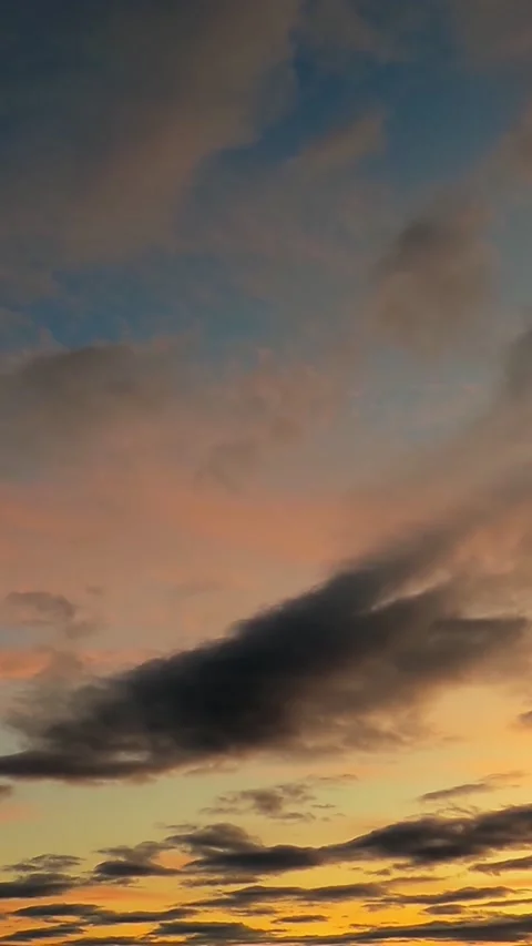The movement of clouds at dusk at sunset. The timelapse of clouds. Stock Footage 267647484