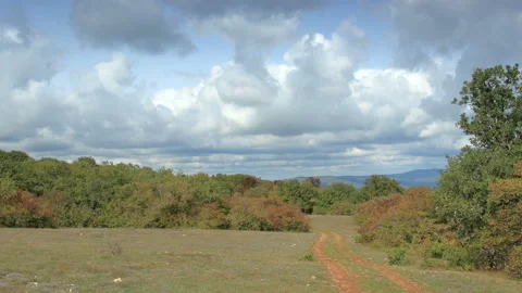Movement of the clouds on the mountain on a dirt road. Crimea, Russia (TimeLapse Stock Footage 111162898